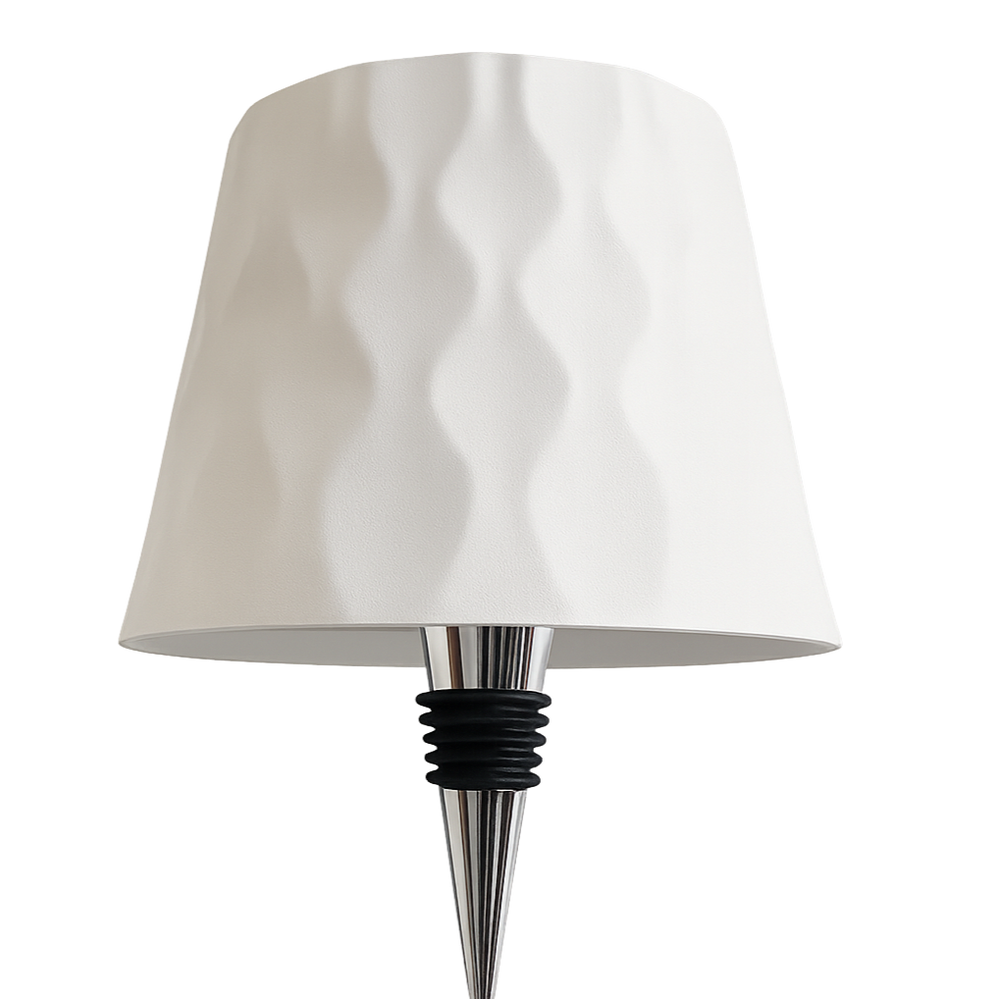 Lamp with a white shade and metallic base on a white background