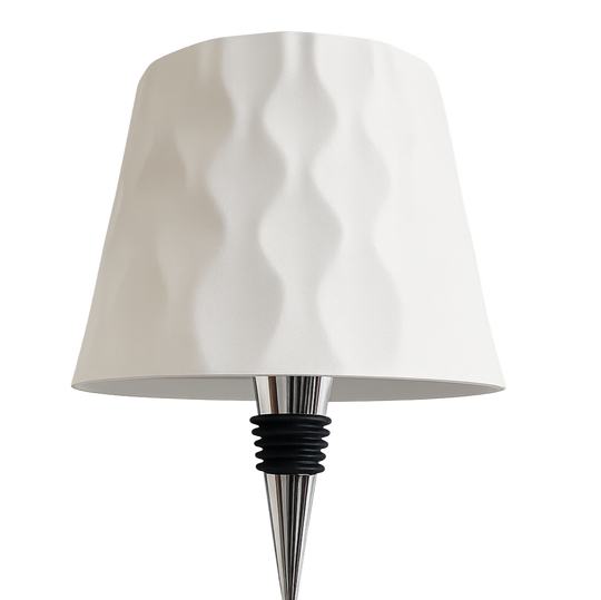 Lamp with a white shade and metallic base on a white background